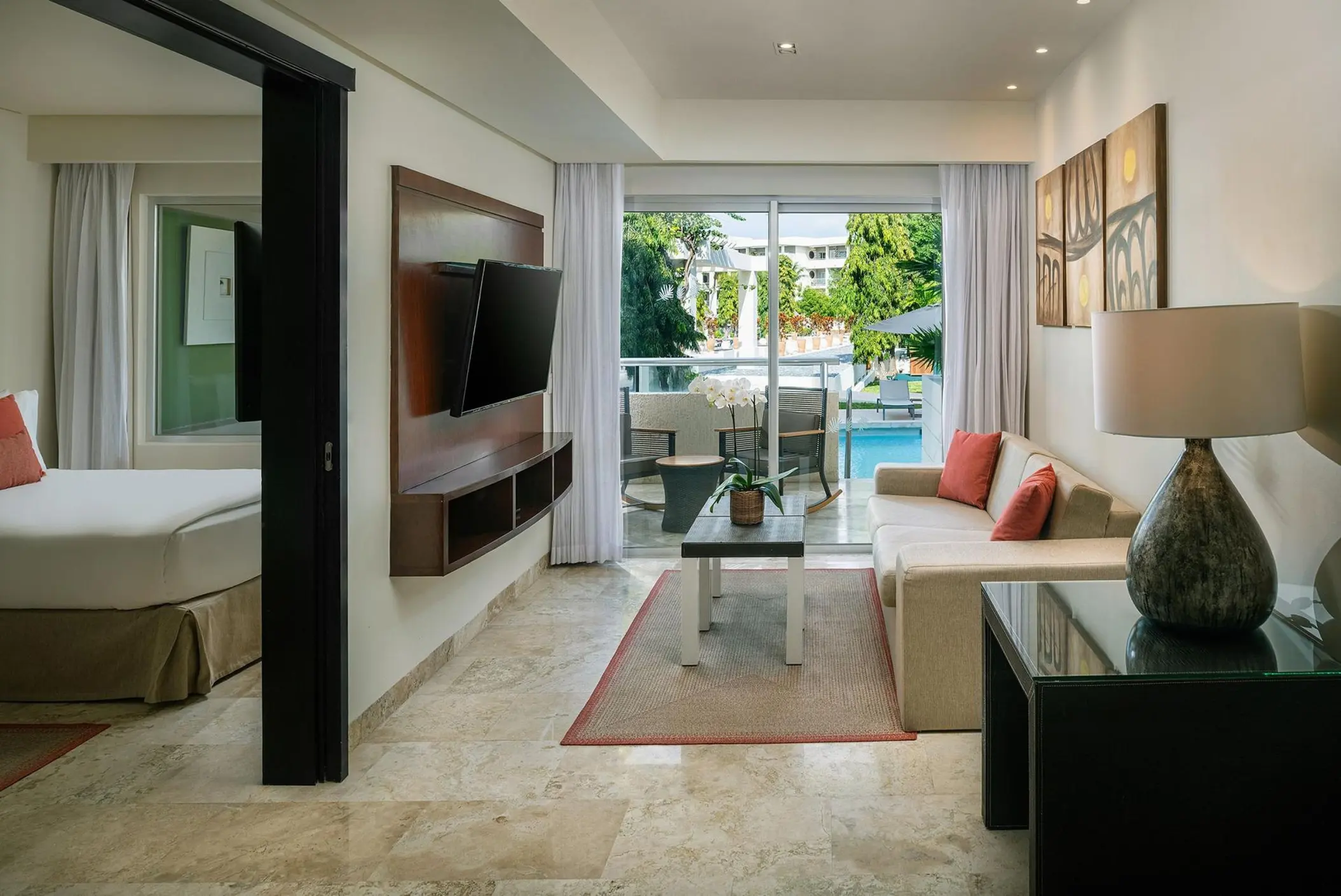 Swim-up suite living area and bedroom at Paradisus Playa Del Carmen