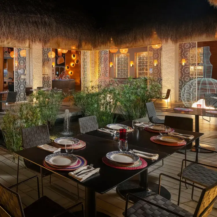 Outdoor seating area at Blue Agave Taqueria at Paradisus Playa Del Carmen