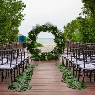 Floral circle arch for a bridge wedding ceremony at Paradisus La Perla, Playa Del Carmen