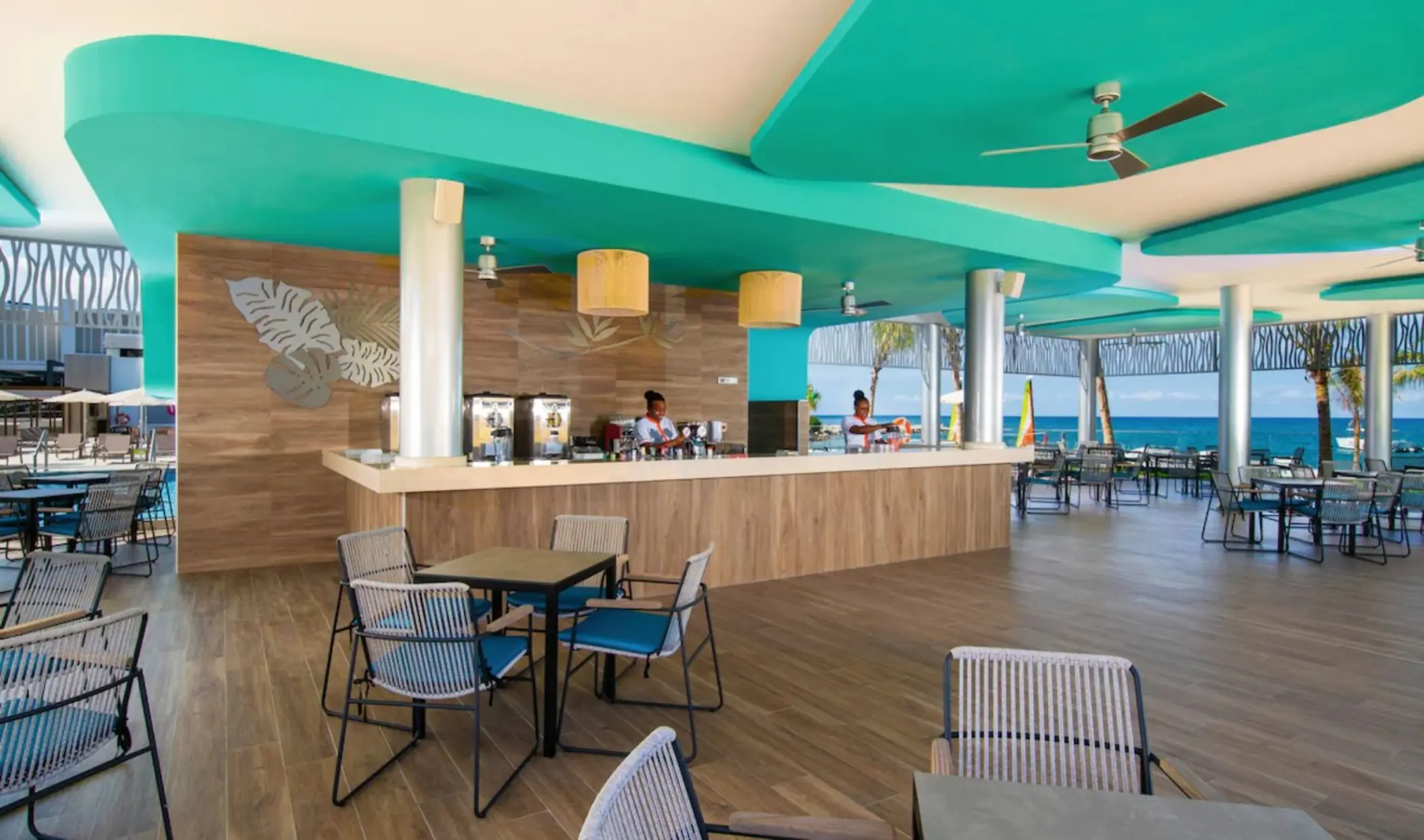 Outdoor bar with turquoise accents and ocean views at Riu Montego Bay, Montego Bay