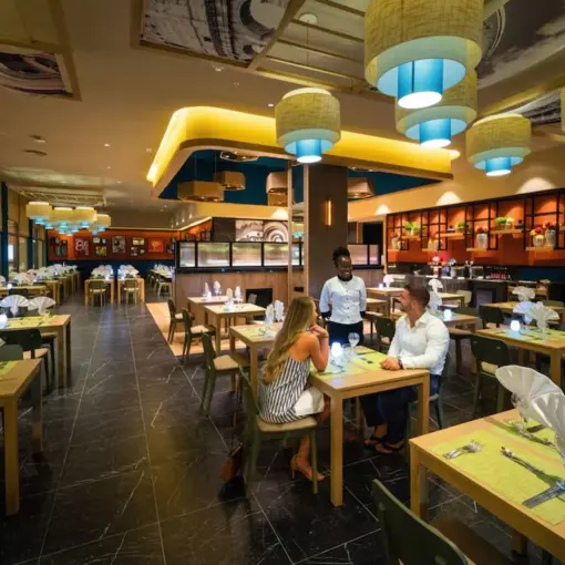 Modern buffet restaurant with colorful pendant lights at Riu Montego Bay, Montego Bay