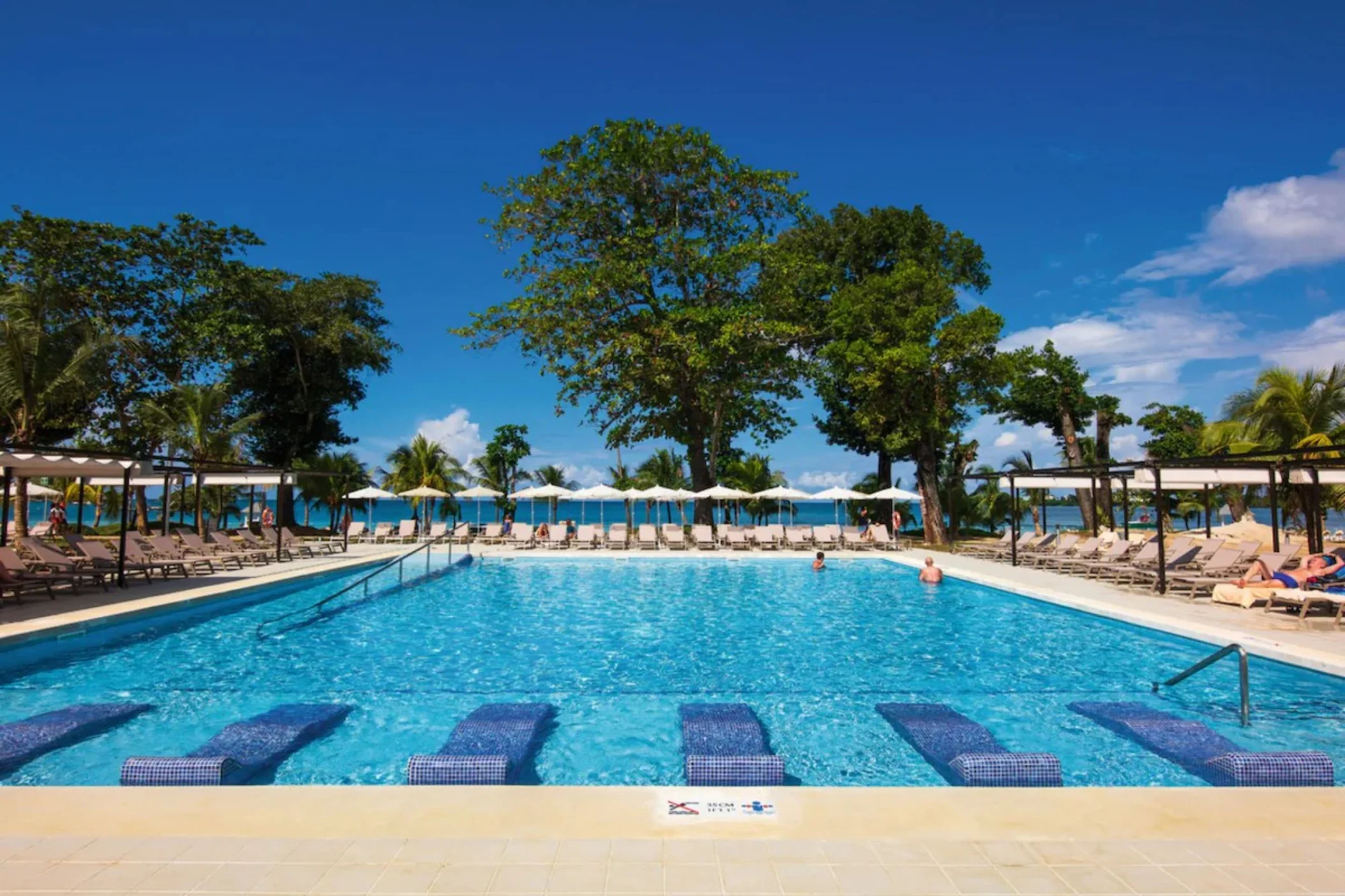 pool with in-pool loungers at Riu Palace Tropical Bay