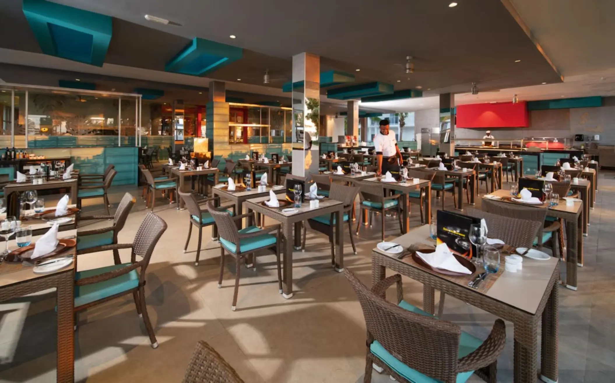 Modern buffet restaurant interior with set tables at Riu Palace Tropical Bay, Negril