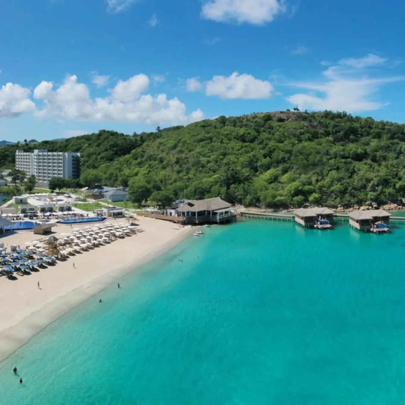 Aerial view of Royalton Antigua beachfront and overwater bungalows, Five Islands Village