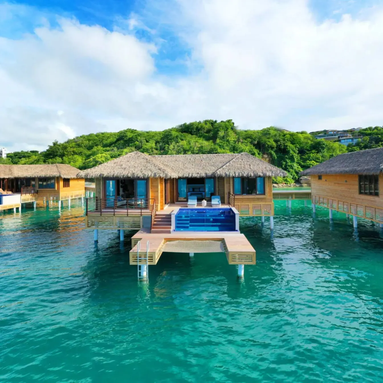 Chairman overwater bungalows with private infinity pools at Royalton Antigua, Five Islands Village