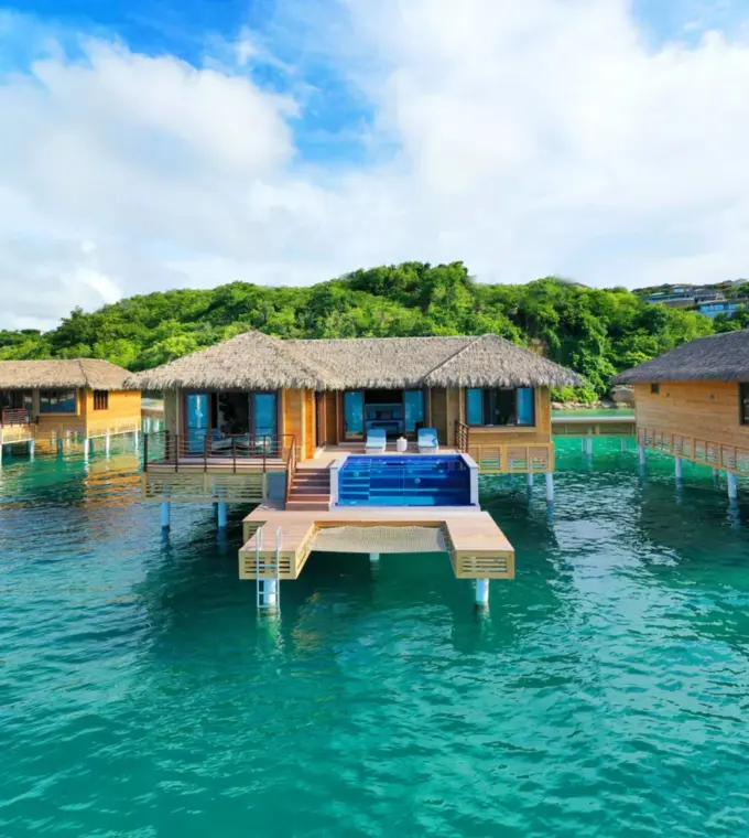 Chairman overwater bungalows with private infinity pools at Royalton Antigua, Five Islands Village
