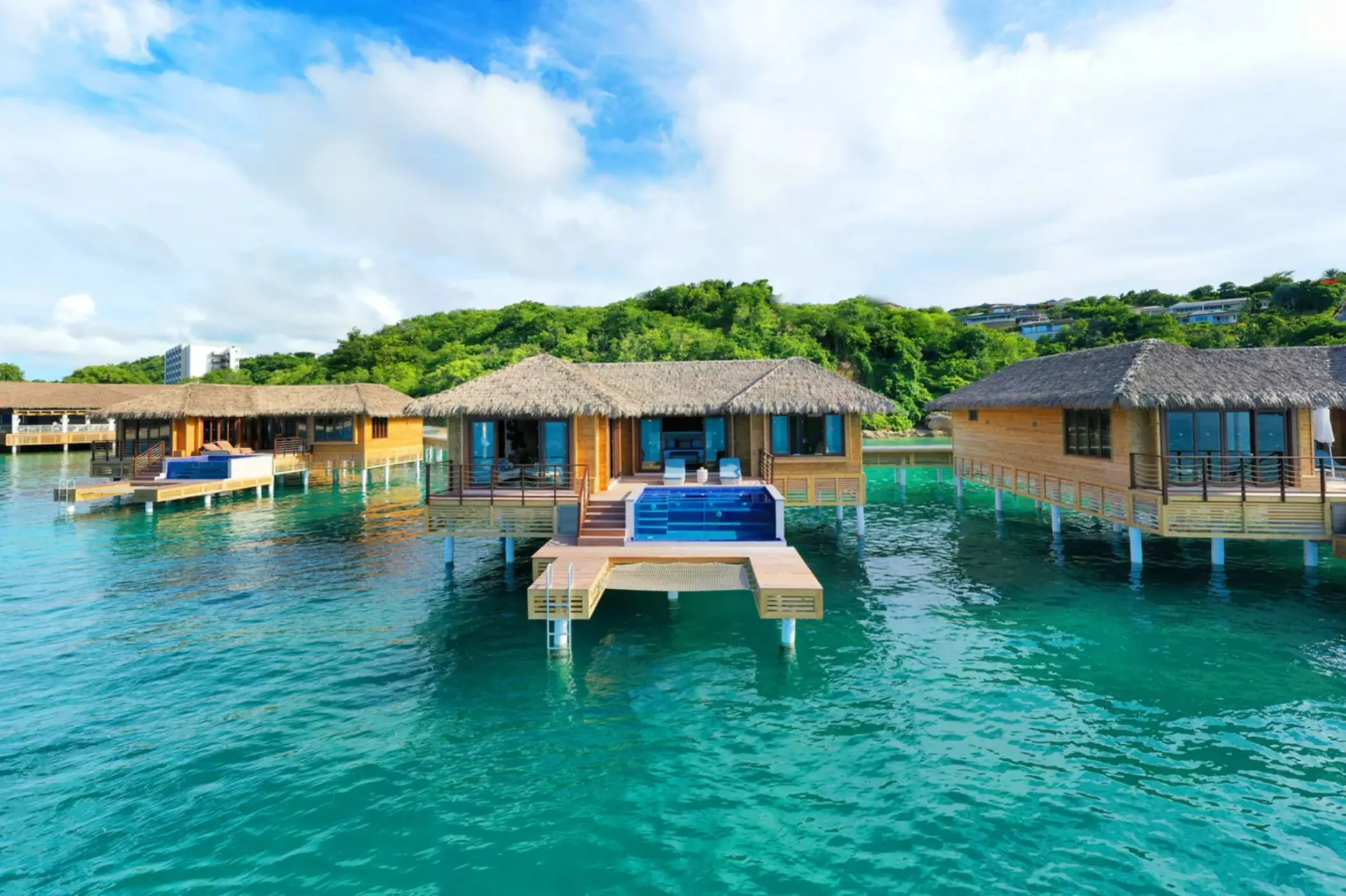 Chairman overwater bungalows with private infinity pools at Royalton Antigua, Five Islands Village