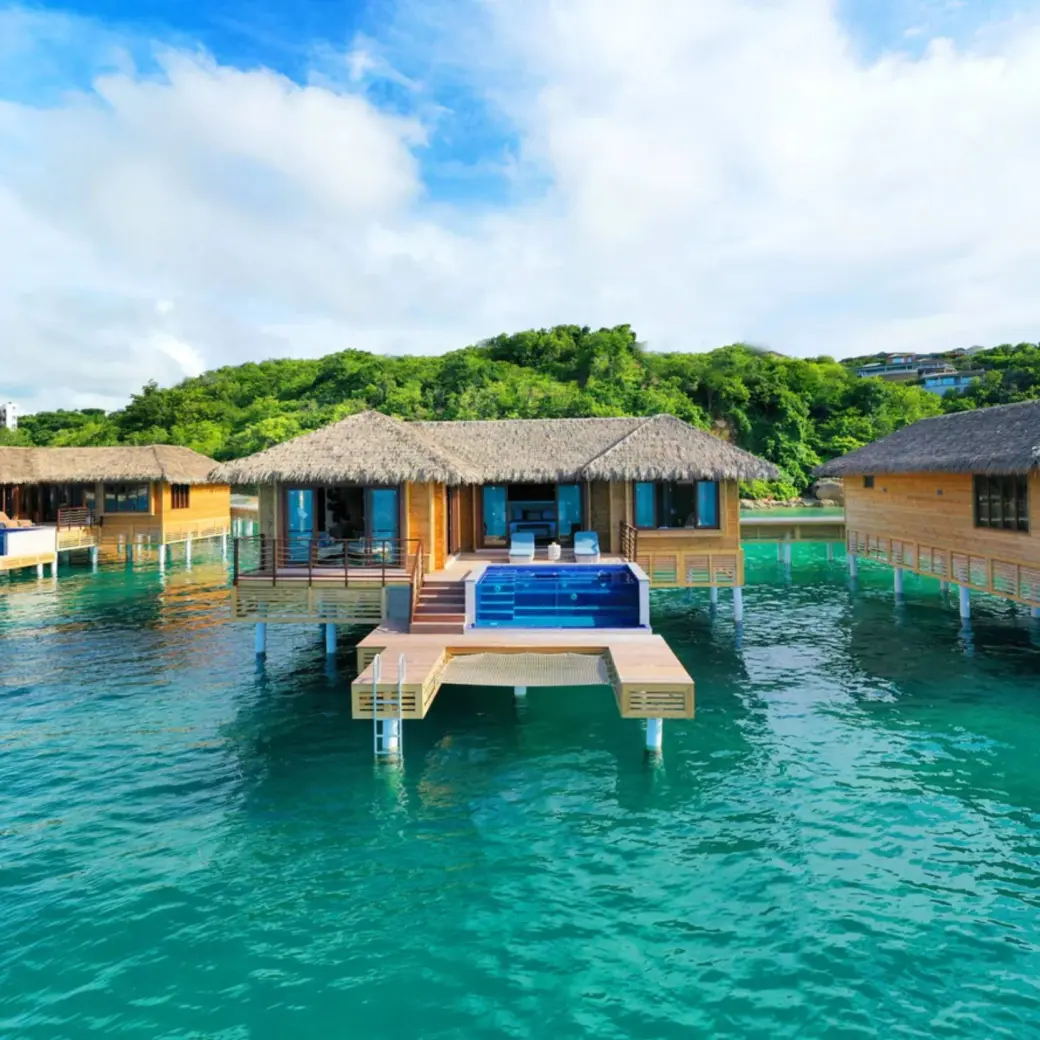 Chairman overwater bungalows with private infinity pools at Royalton Antigua, Five Islands Village