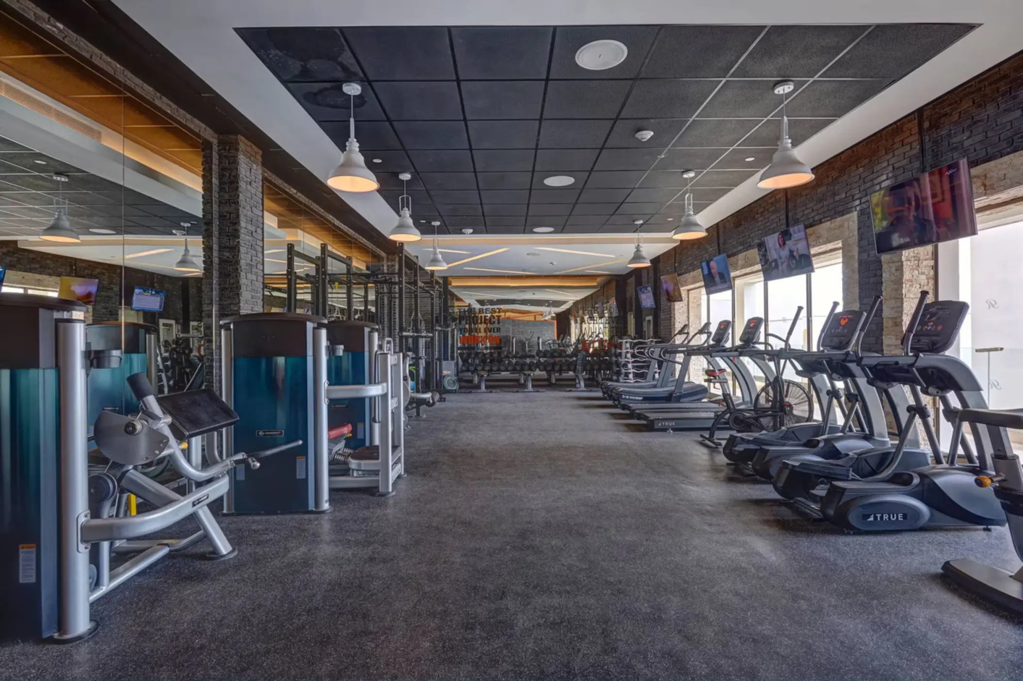 Fitness center with treadmills and weight machines at Royalton Antigua, Five Islands Village