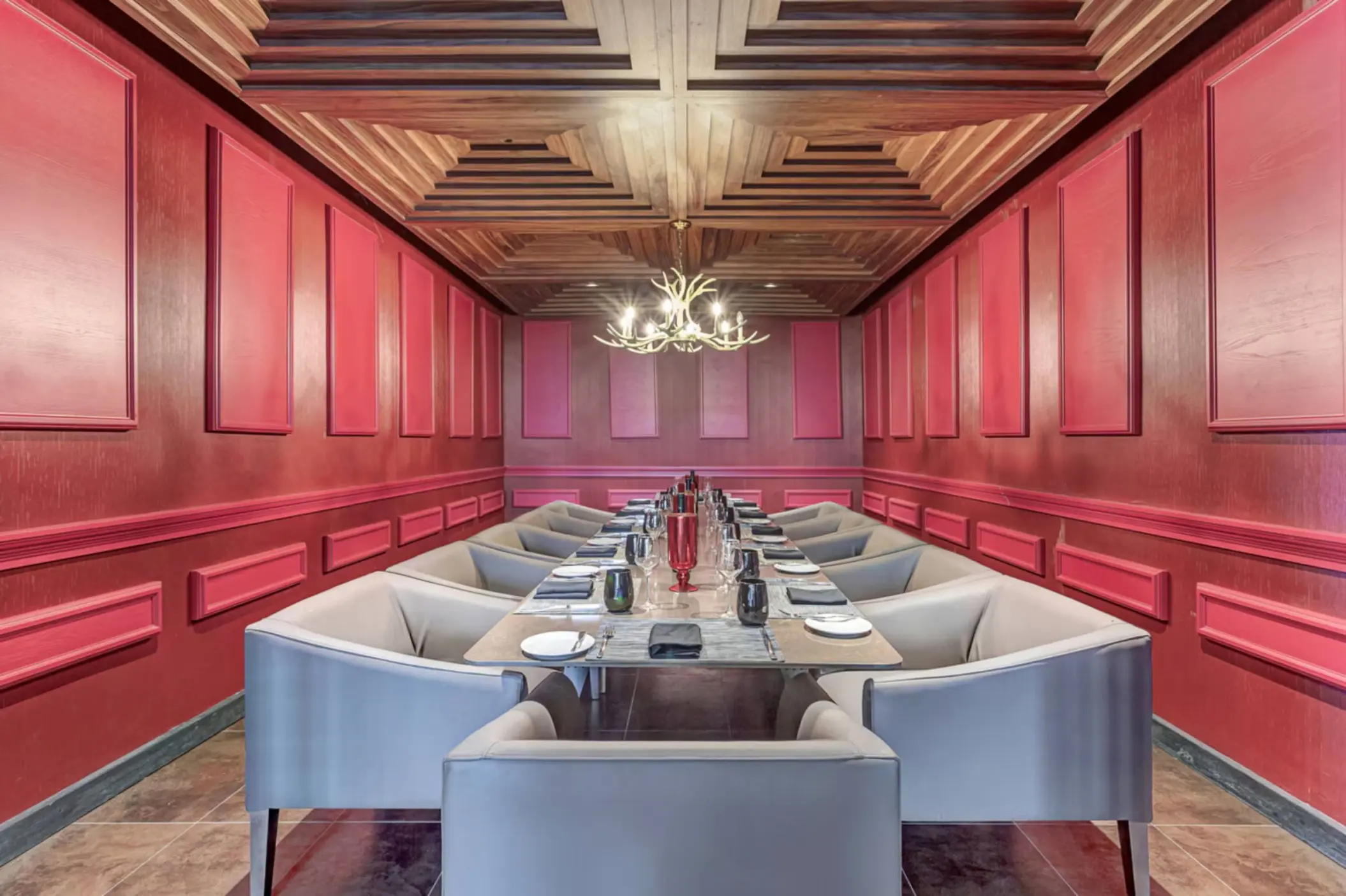 Hunter Steakhouse private dining room with red wood paneling at Royalton Antigua, Five Islands Village