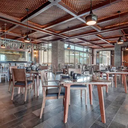 Hunter Steakhouse wedding reception venue with wood paneled ceilings at Royalton Antigua, Five Islands Village