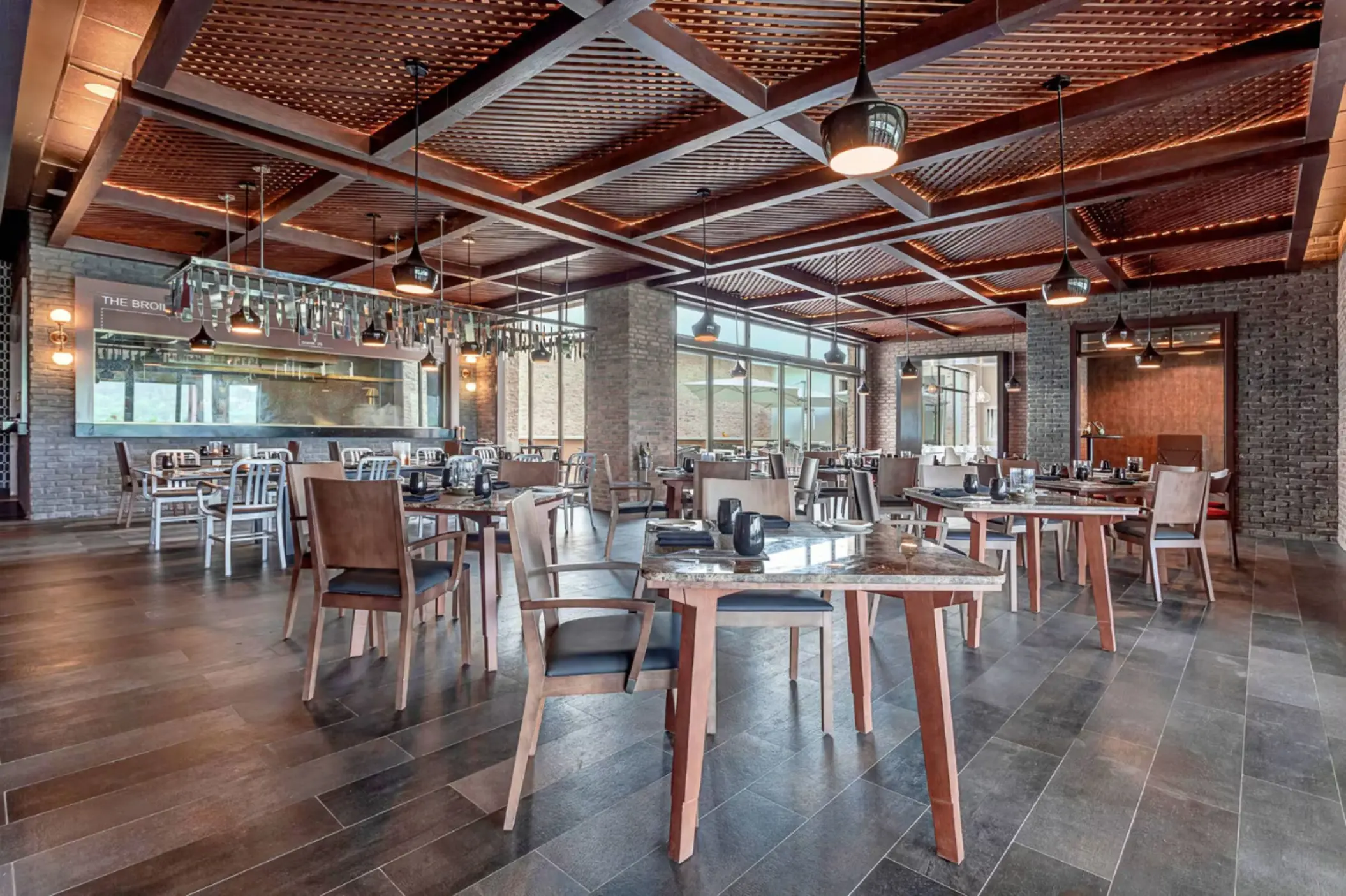 Hunter Steakhouse wedding reception venue with wood paneled ceilings at Royalton Antigua, Five Islands Village
