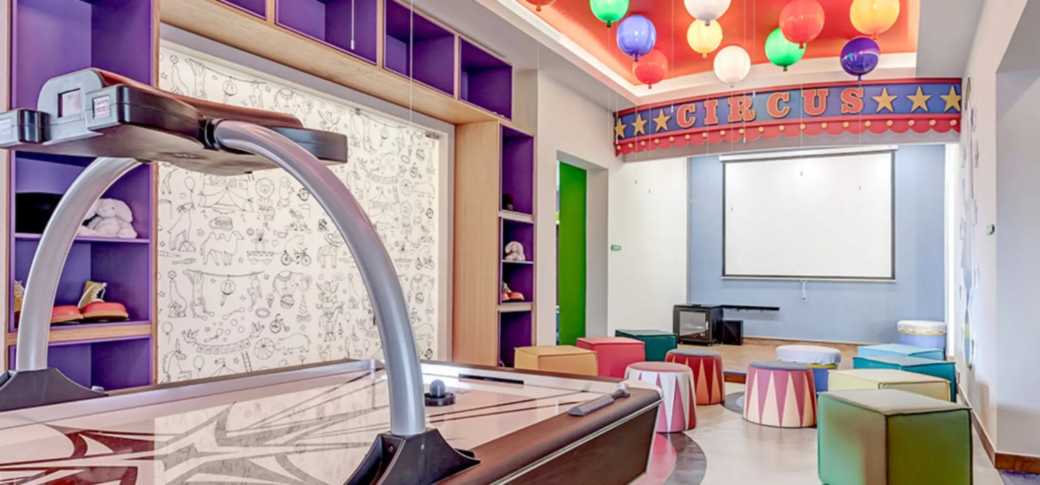 Colorful kids club with air hockey and theater seating at Royalton Antigua, Five Islands Village