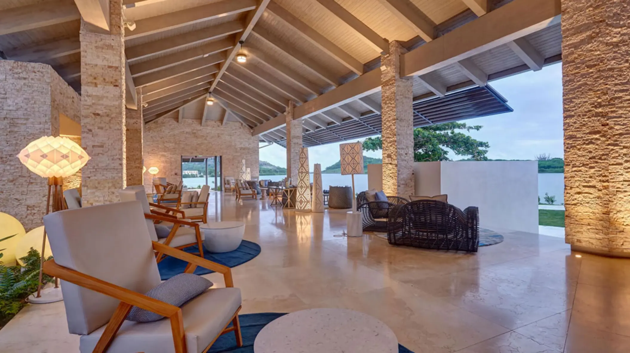Open-air lobby with vaulted ceilings and stone pillars at Royalton Antigua, Five Islands Village