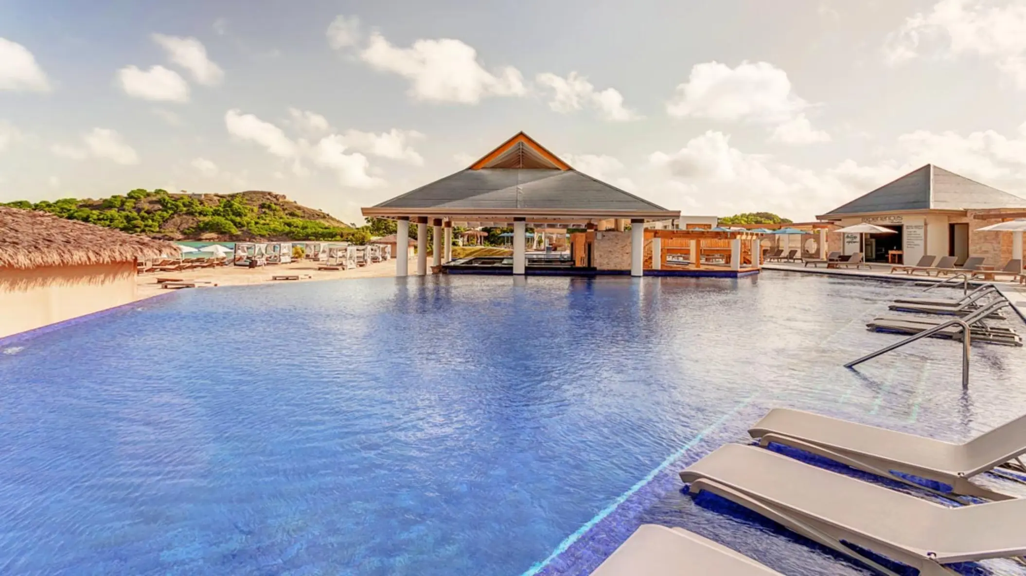 Infinity pool and swim-up bar at Royalton Antigua, Five Islands Village