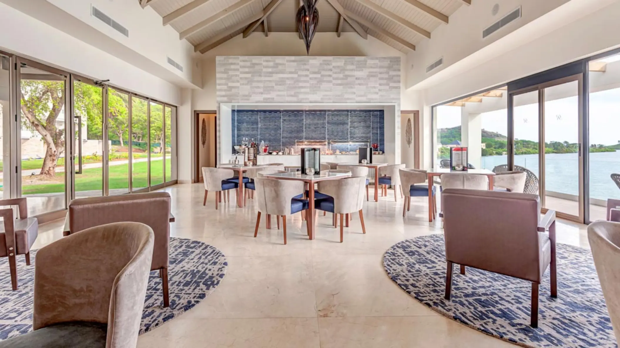 Modern open-air restaurant with vaulted ceilings and ocean views at Royalton Antigua, Five Islands Village
