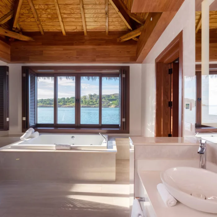 washroom with hot tub of chairman overwater bungalow at Royalton Antigua