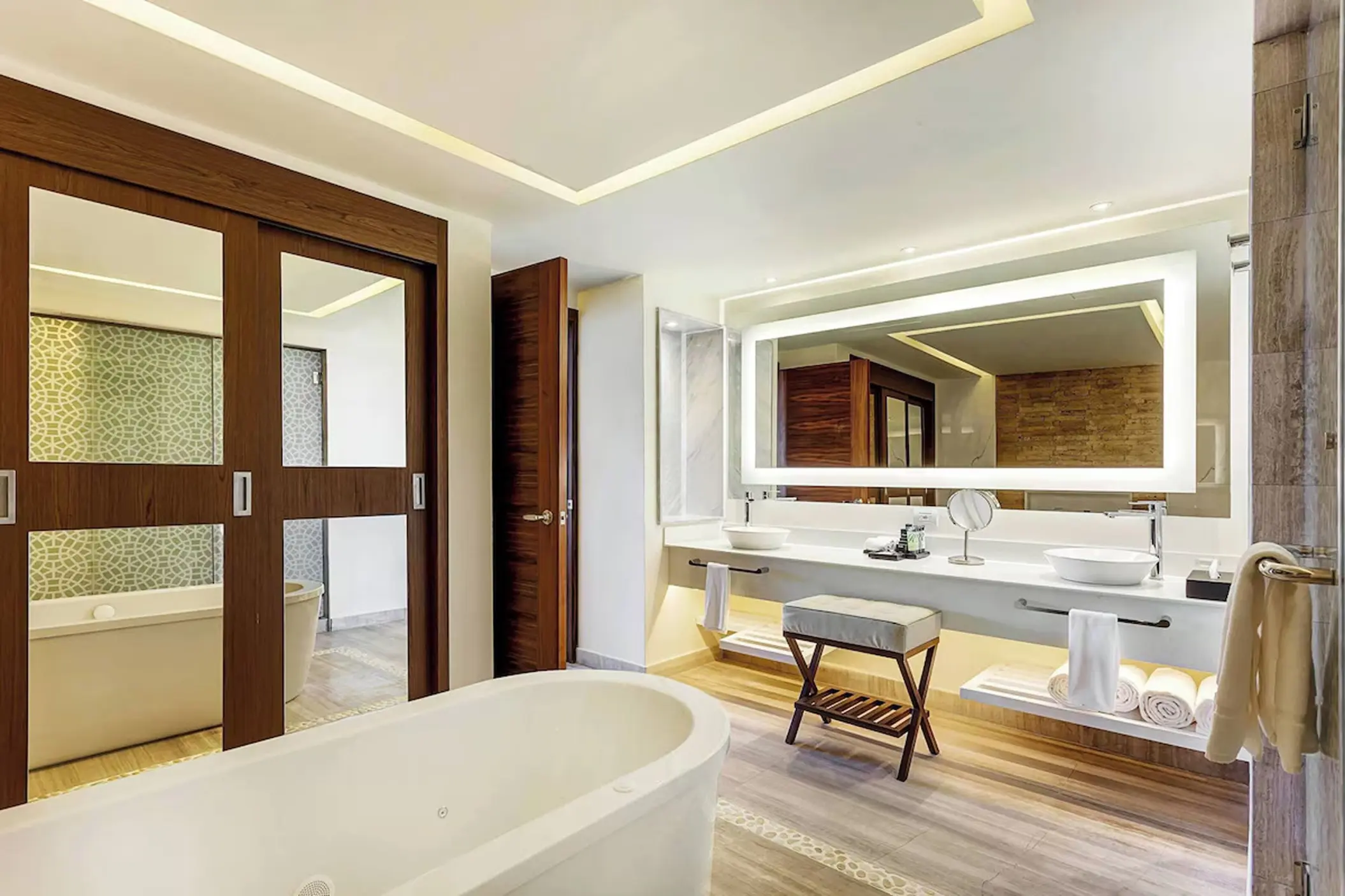 Royalton Bavaro modern suite bathroom with a soaking tub and double vanity, Punta Cana