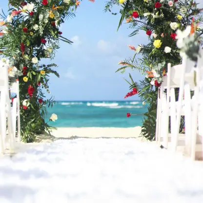 Floral wedding ceremony arch on the beach at Royalton Bavaro, Punta Cana