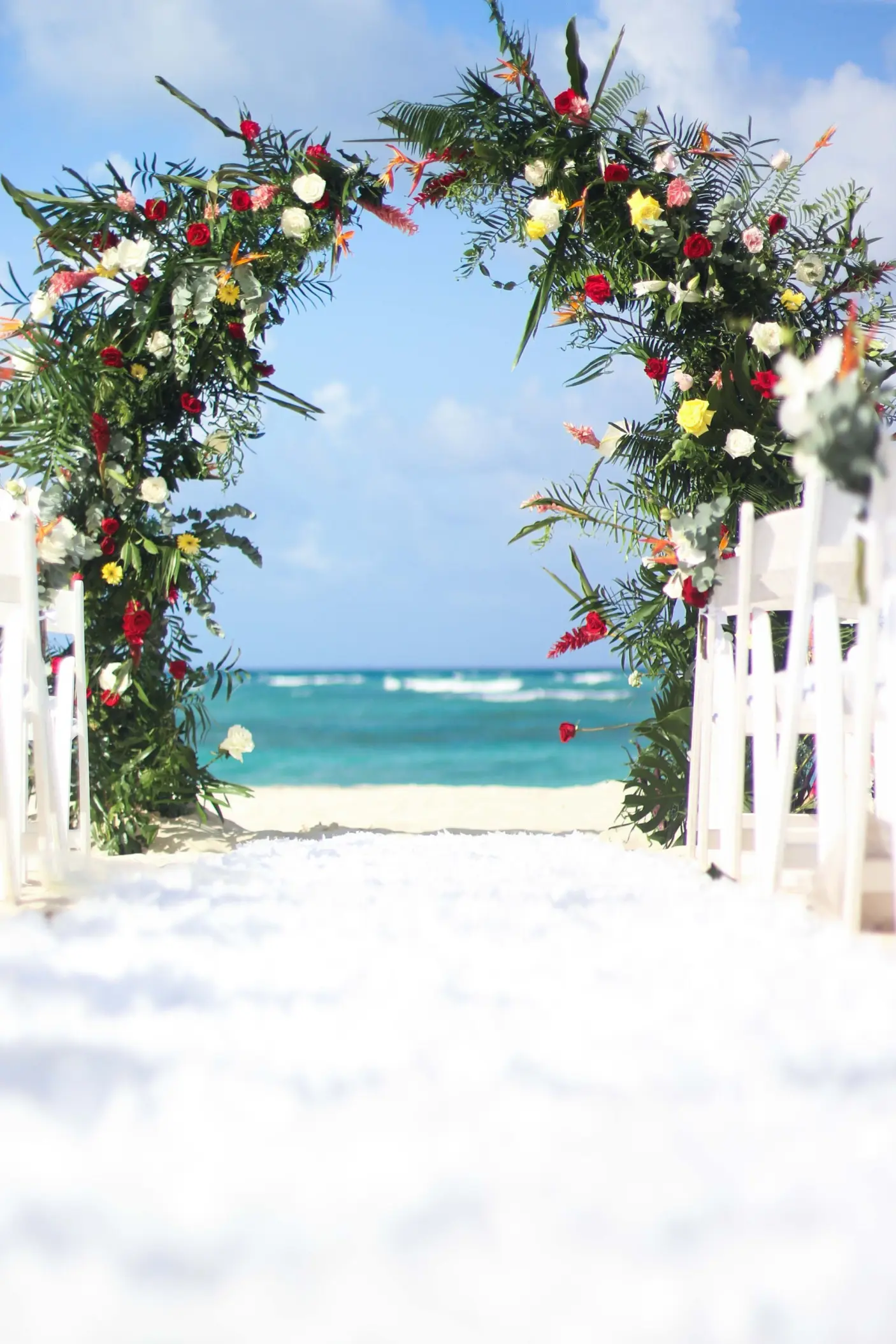 Floral wedding ceremony arch on the beach at Royalton Bavaro, Punta Cana