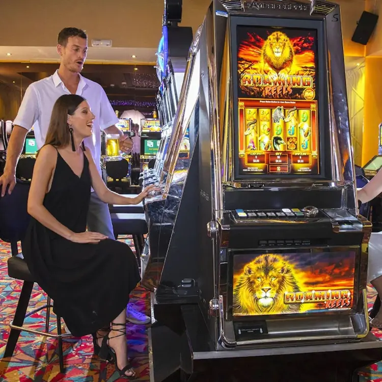 Guests playing slot machines at the Royalton Bavaro casino, Punta Cana