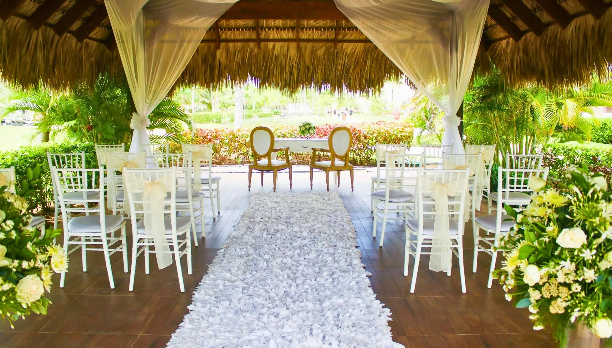 Garden gazebo wedding ceremony setup with a petal aisle at Royalton Bavaro, Punta Cana