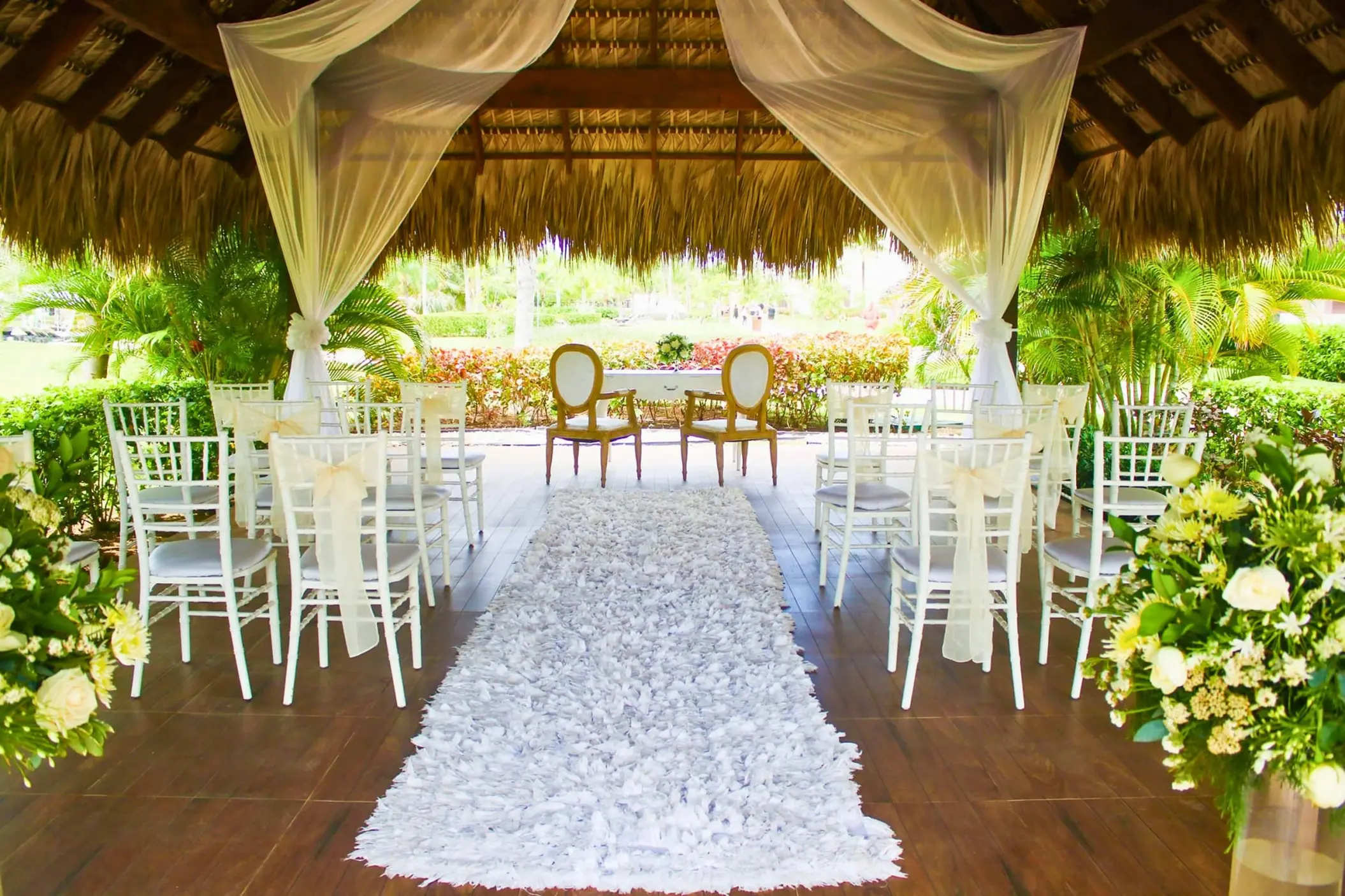 Garden gazebo wedding ceremony setup with a petal aisle at Royalton Bavaro, Punta Cana