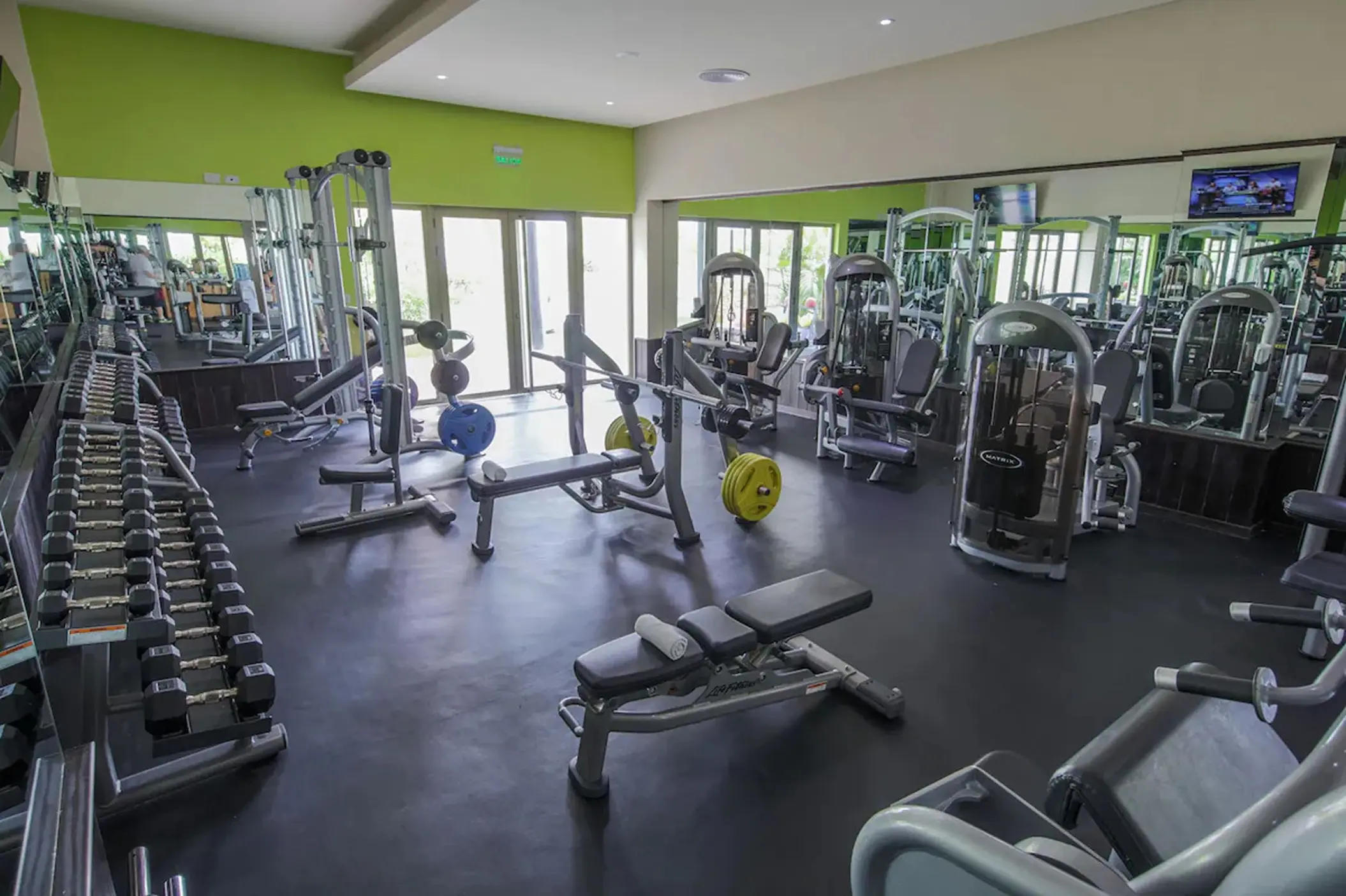Weight room with dumbbells and strength training machines at Royalton Bavaro, Punta Cana