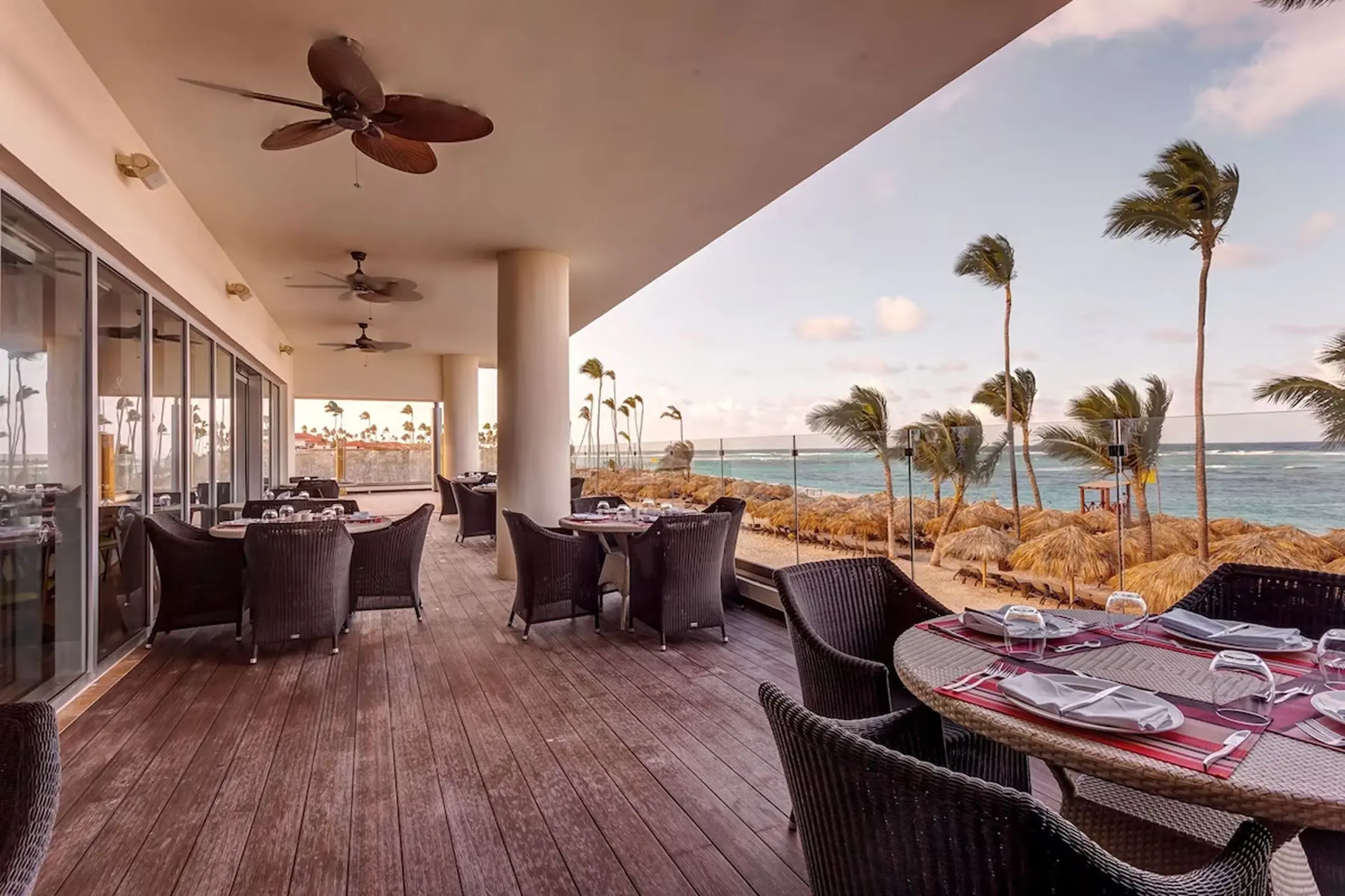 Outdoor restaurant terrace with ocean views at Royalton Bavaro, Punta Cana