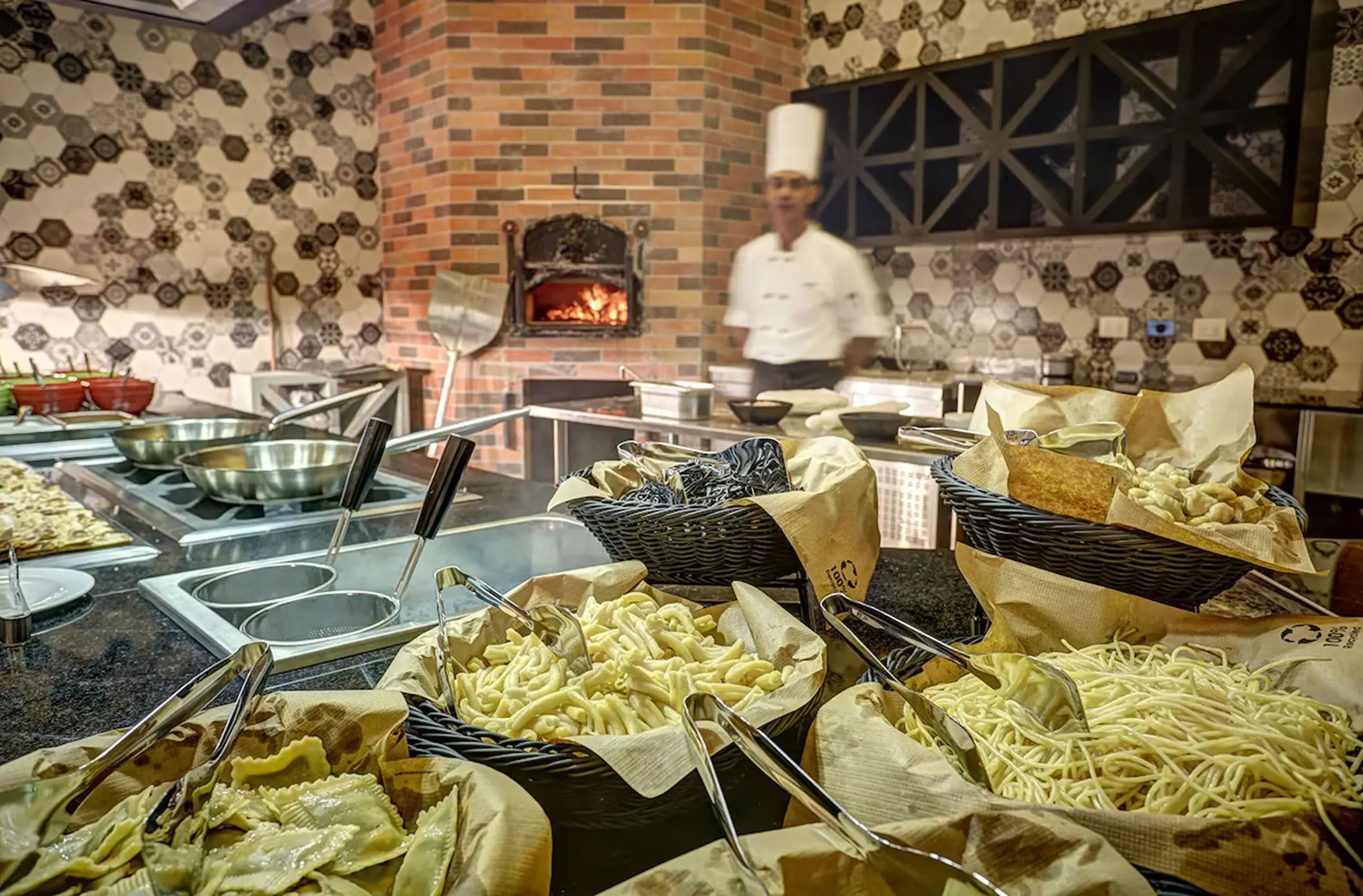 Pasta station and pizza oven at a Royalton Bavaro restaurant, Punta Cana