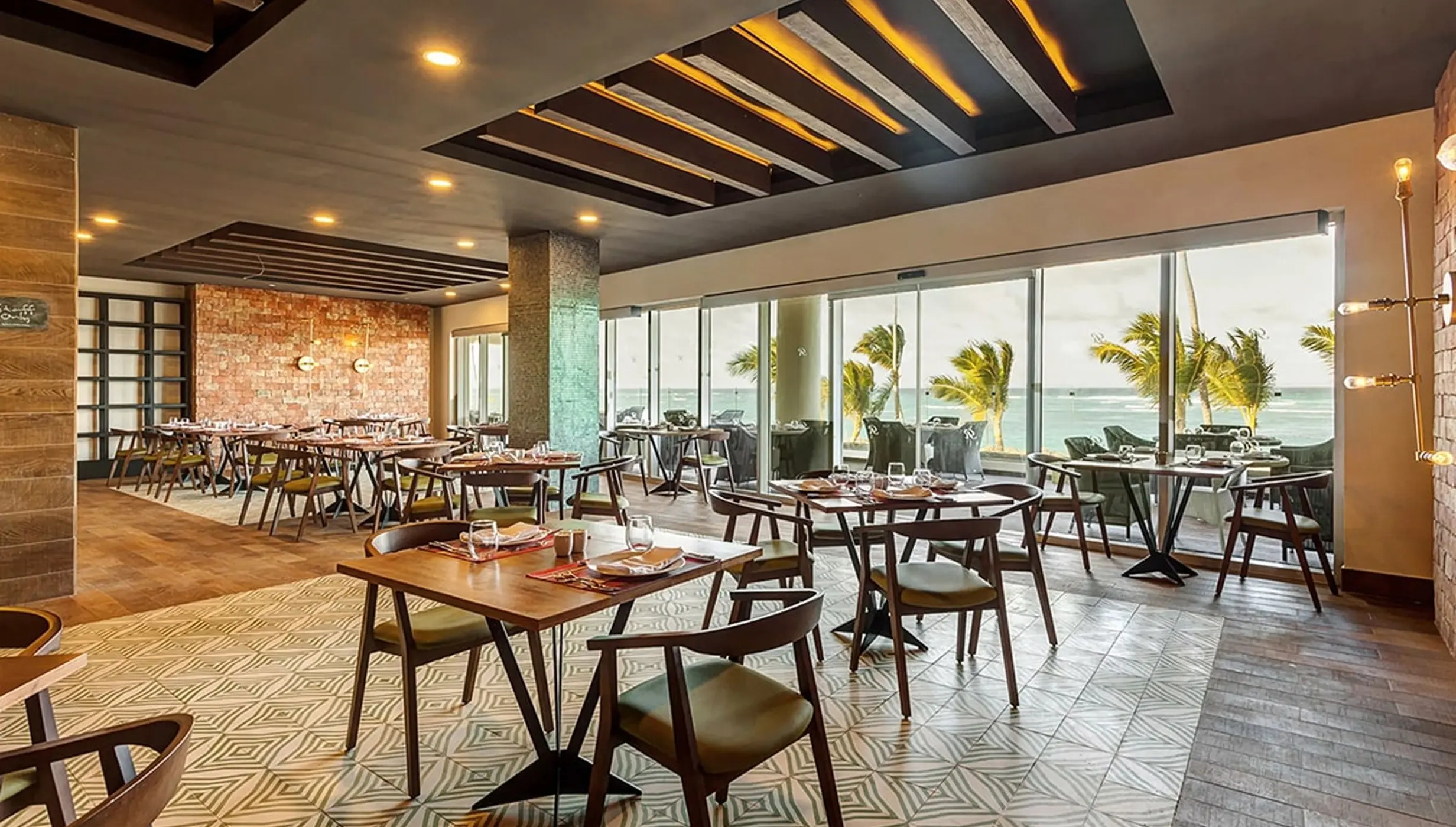 Rio Brazilian Grill dining room with floor-to-ceiling ocean views at Royalton Bavaro, Punta Cana