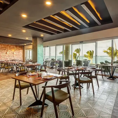 Rio Brazilian Grill dining room with floor-to-ceiling ocean views at Royalton Bavaro, Punta Cana