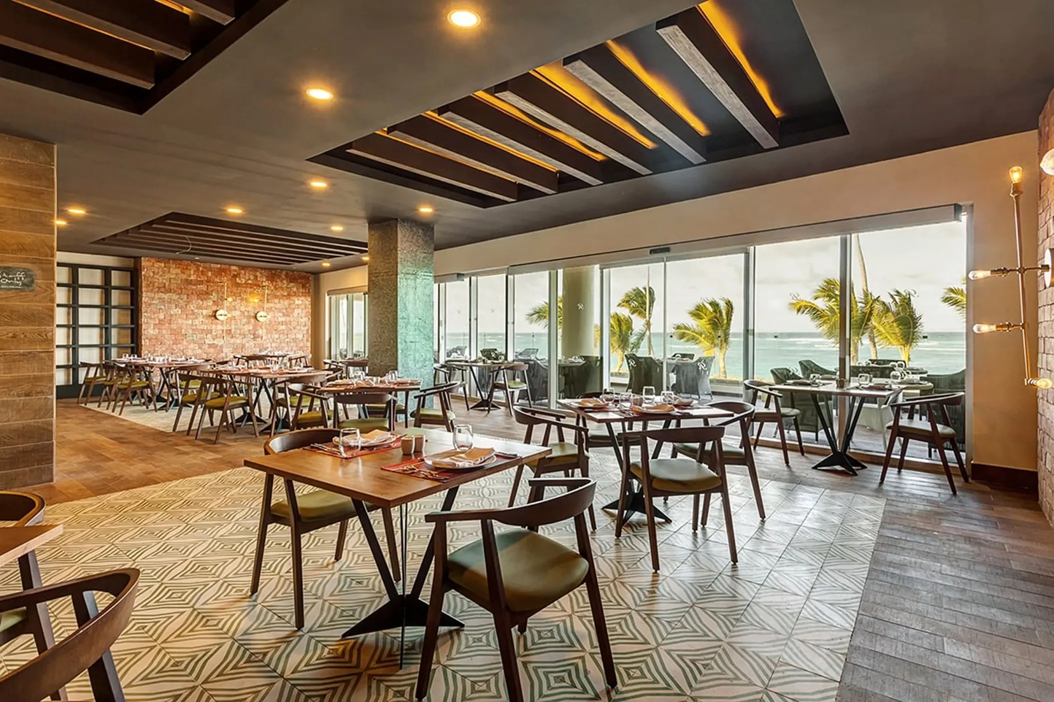 Rio Brazilian Grill dining room with floor-to-ceiling ocean views at Royalton Bavaro, Punta Cana