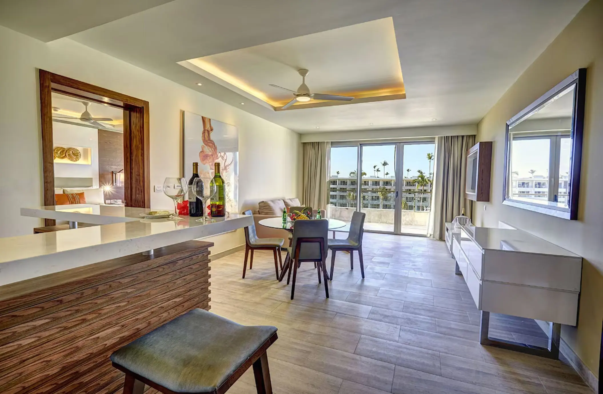 Royalton Bavaro guest suite living area and dining table with balcony, Punta Cana