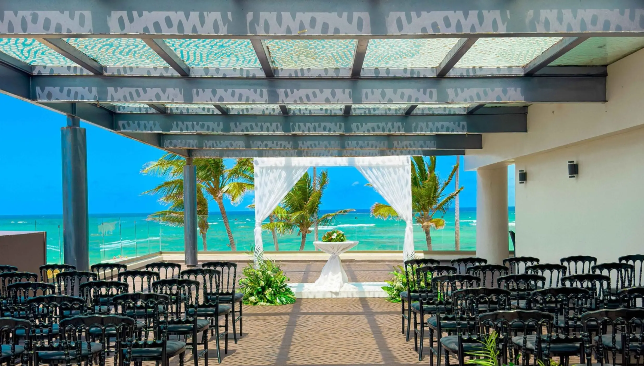 Sky terrace wedding ceremony setup with ocean views at Royalton Bavaro, Punta Cana