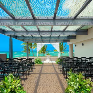 Sky terrace wedding ceremony setup with ocean views at Royalton Bavaro, Punta Cana