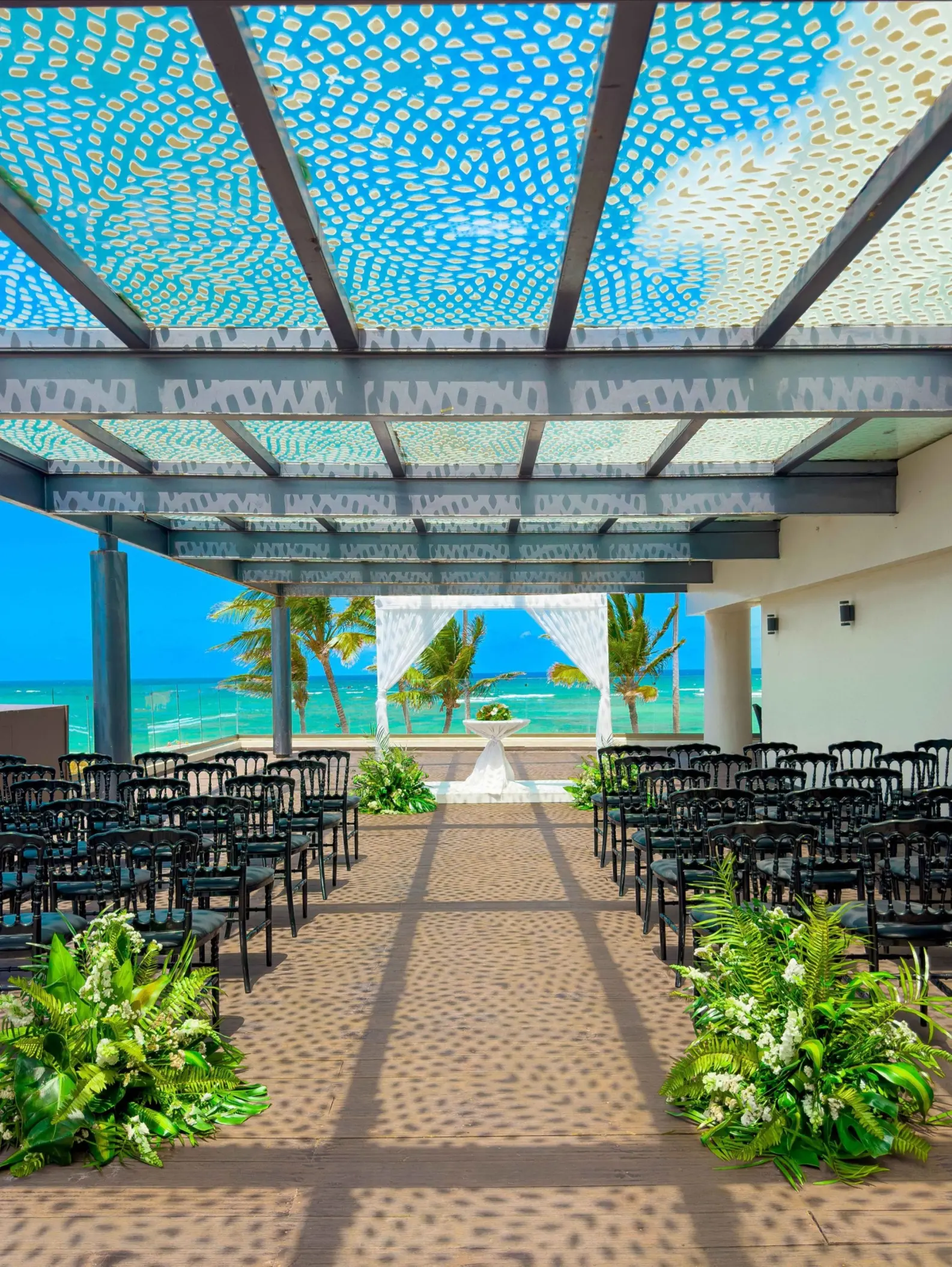 Sky terrace wedding ceremony setup with ocean views at Royalton Bavaro, Punta Cana