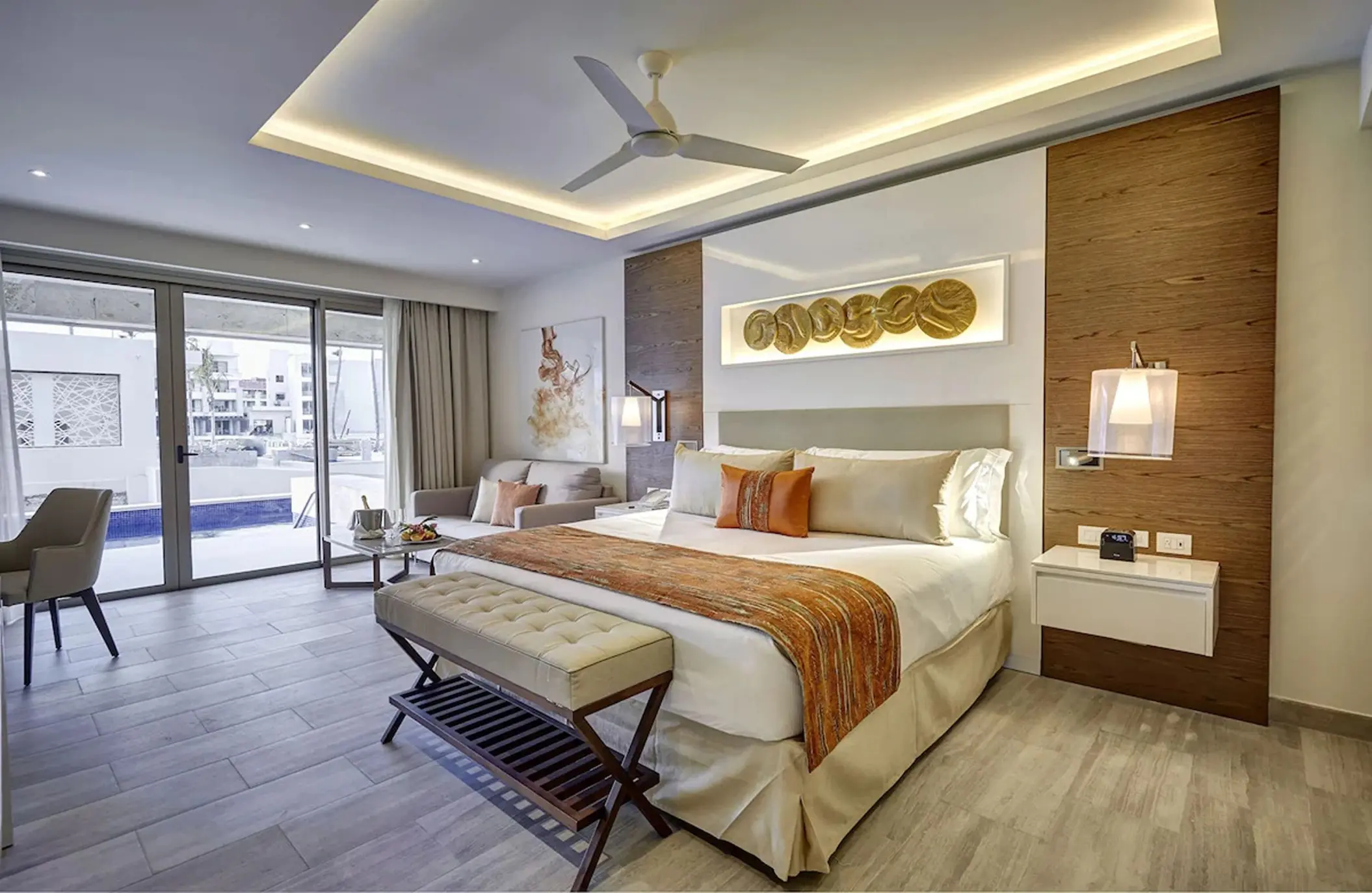 Swim-out suite with modern decor and king bed at Royalton Bavaro, Punta Cana