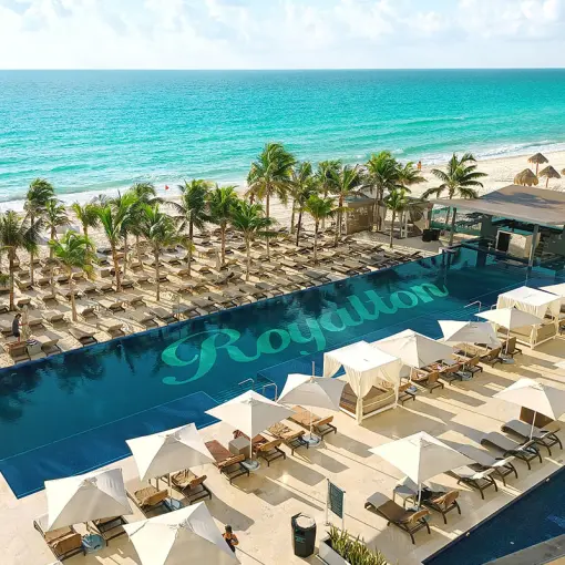 Beachfront swimming pool and lounge area at Royalton CHIC Cancun