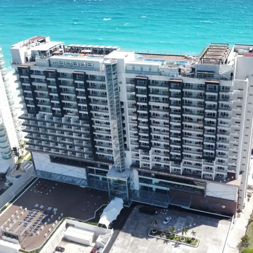Aerial view of Royalton CHIC Cancun tower and beachfront, Cancun