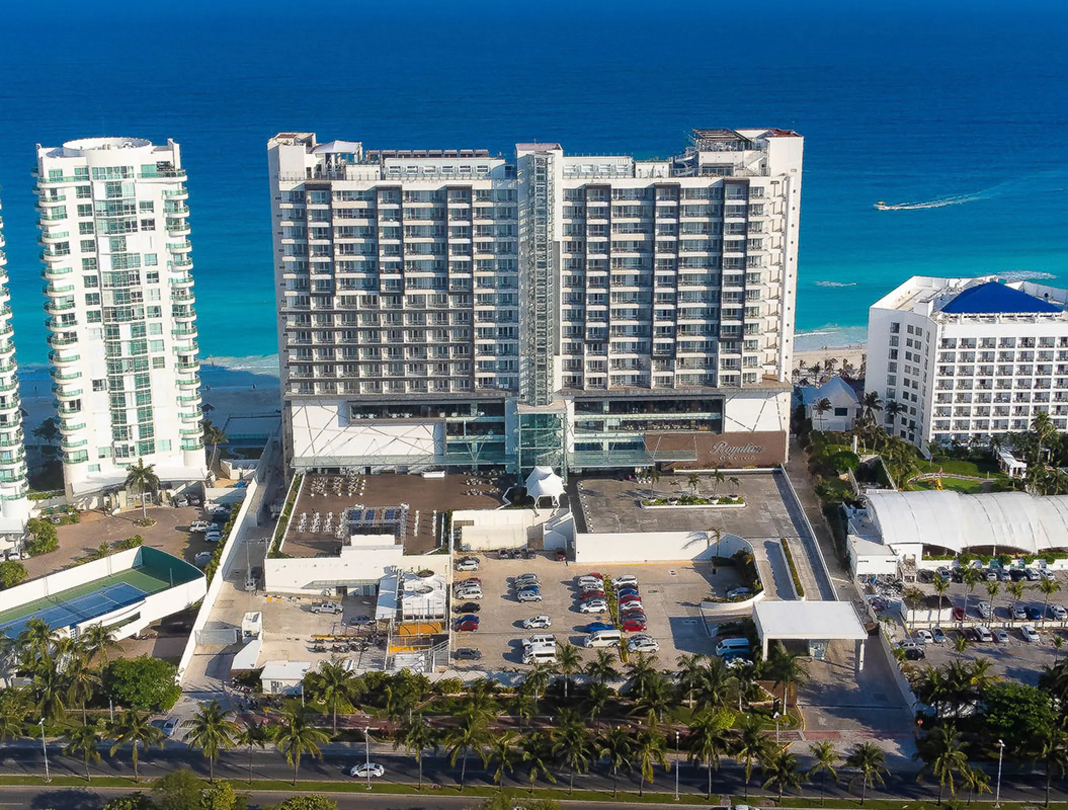 Aerial view of Royalton CHIC Cancun building and grounds against the turquoise Caribbean Sea, Cancun