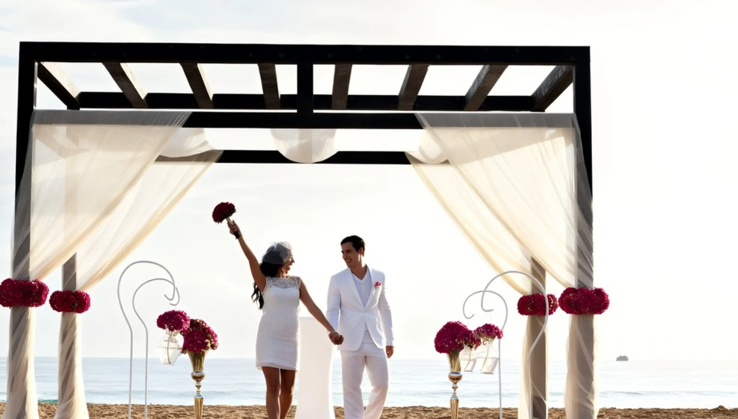 Bride and groom under a beach gazebo during a wedding at Royalton CHIC Punta Cana