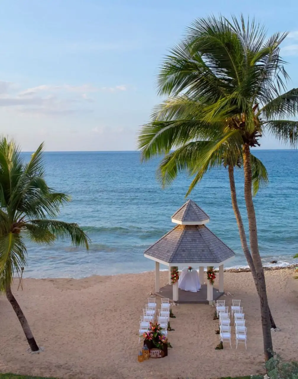 Beachfront wedding ceremony and dinner setup at Royalton Grenada, St. George’s