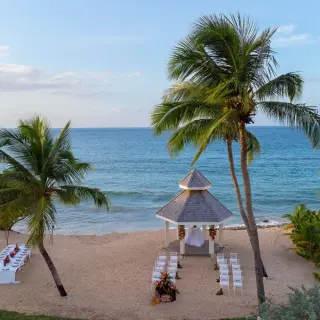 Beachfront wedding ceremony and dinner setup at Royalton Grenada, St. George’s