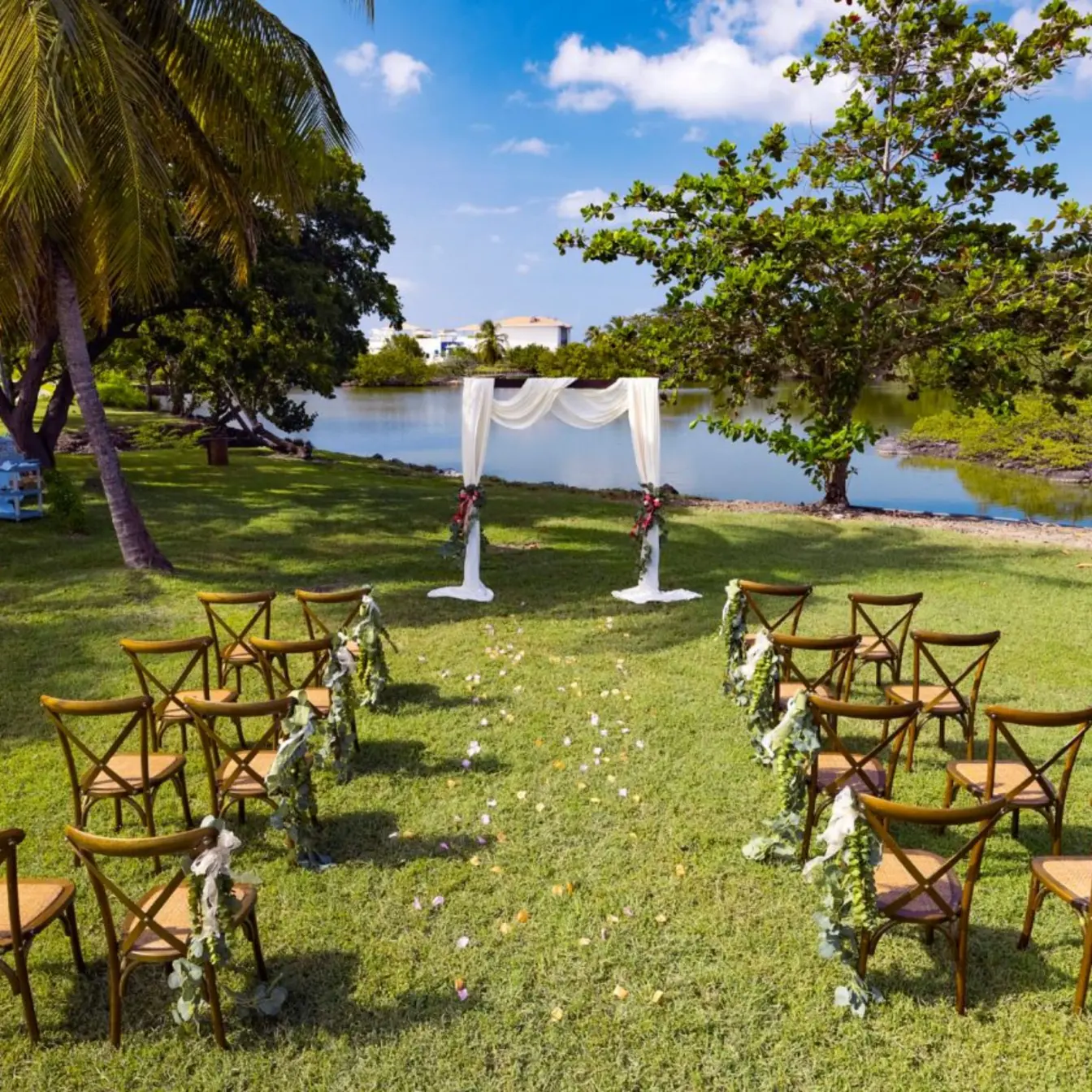 Garden wedding ceremony setup by the water at Royalton Grenada, St. George’s