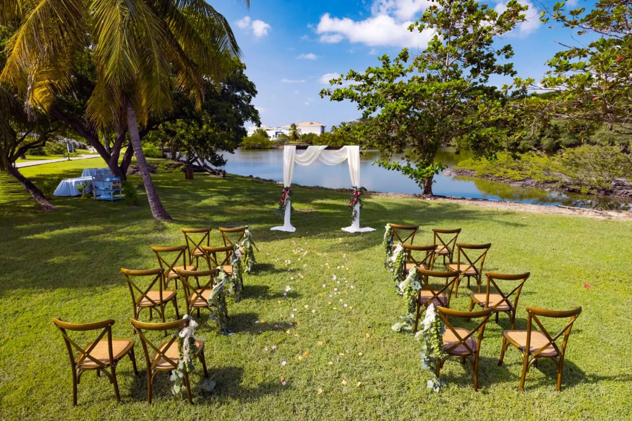 Garden wedding ceremony setup by the water at Royalton Grenada, St. George’s
