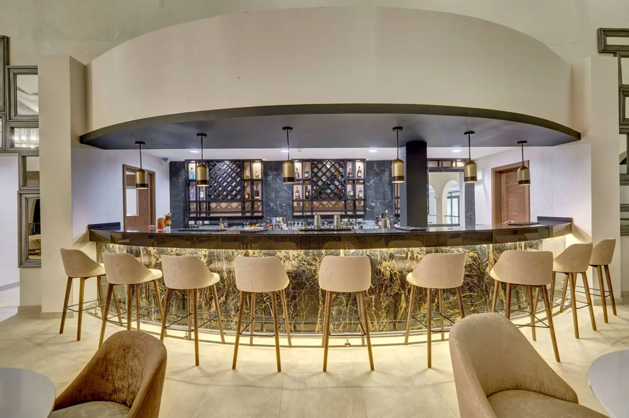 Modern lobby bar with high-top seating and marble finishes at Royalton Grenada, St. George’s
