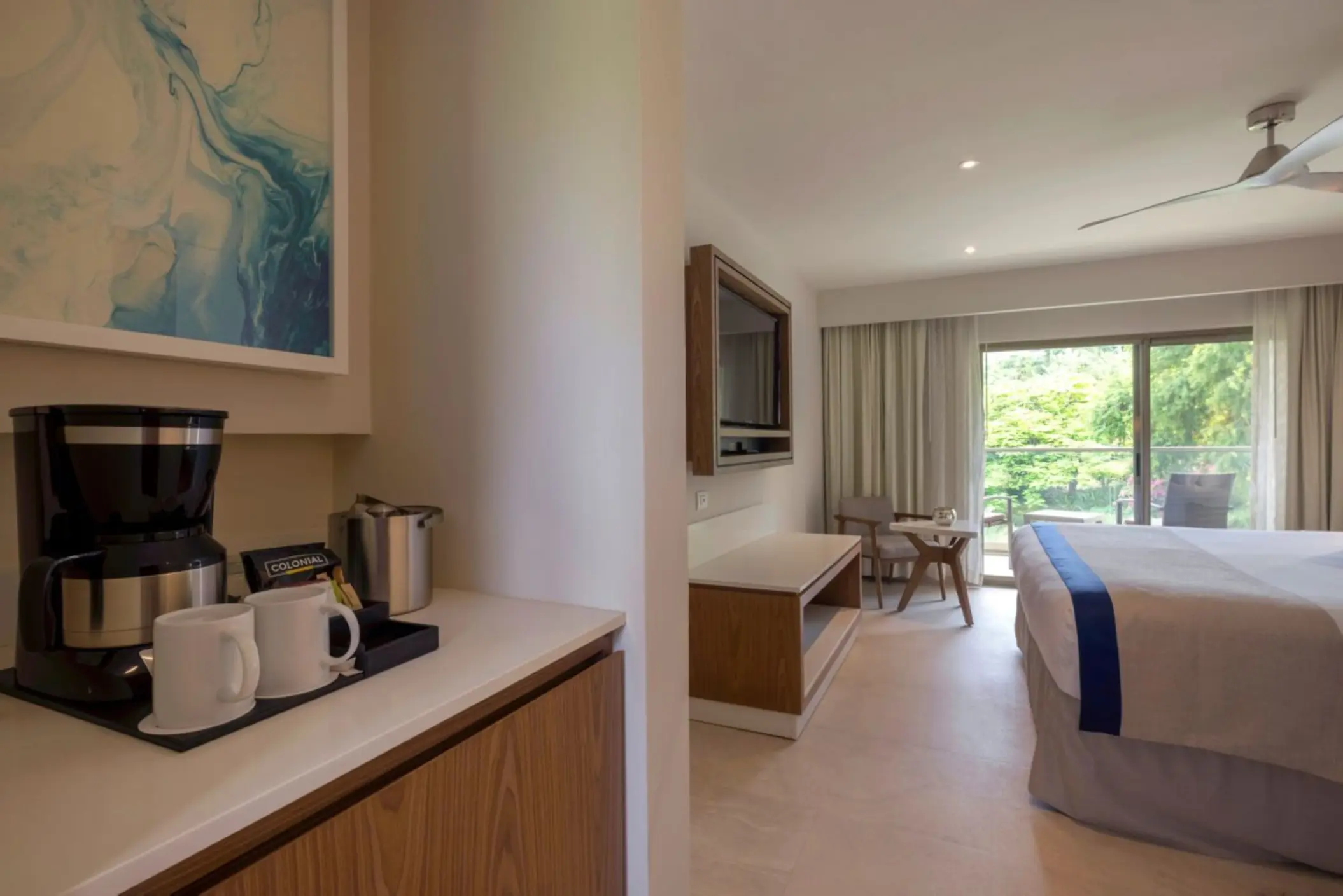 Luxury room with a coffee maker and balcony view at Royalton Grenada, St. George’s