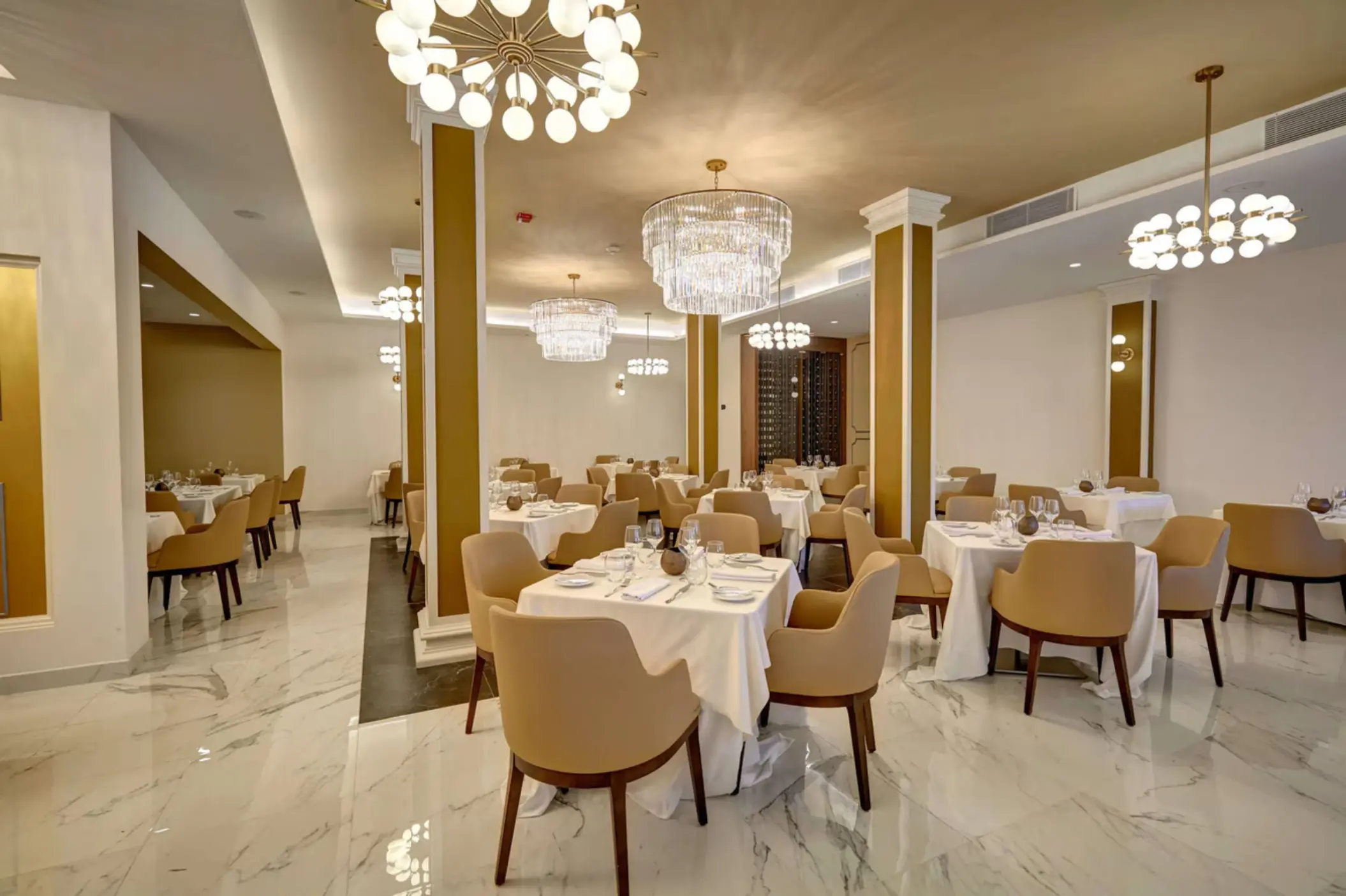 Ma Maison restaurant dining room with elegant chandeliers at Royalton Grenada, St. George’s