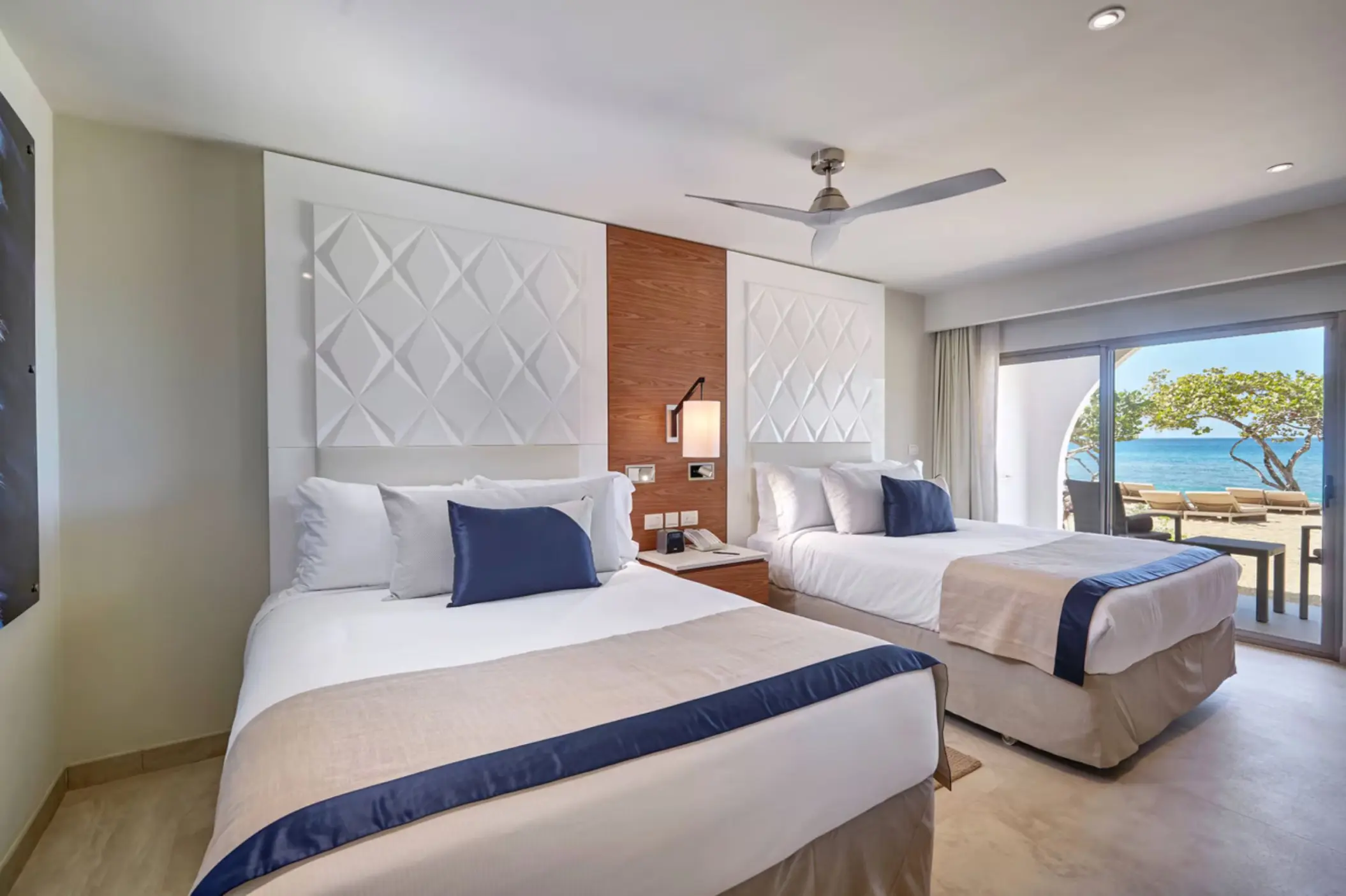 Royalton Grenada suite with two beds and a view of the beach, St. George’s